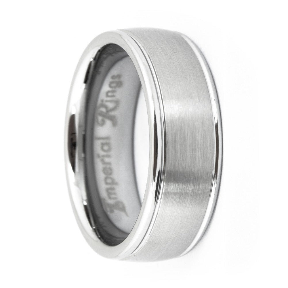 Silver-tone tungsten carbide ring with a broad brushed center, fine border grooves, and rounded polished edges, 8mm wide